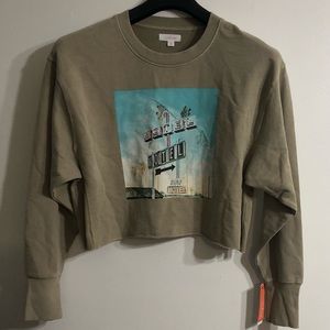 Colsie Women’s crop Top sweatshirt Motel Motel graphic  Surf Motel graphicTan. M